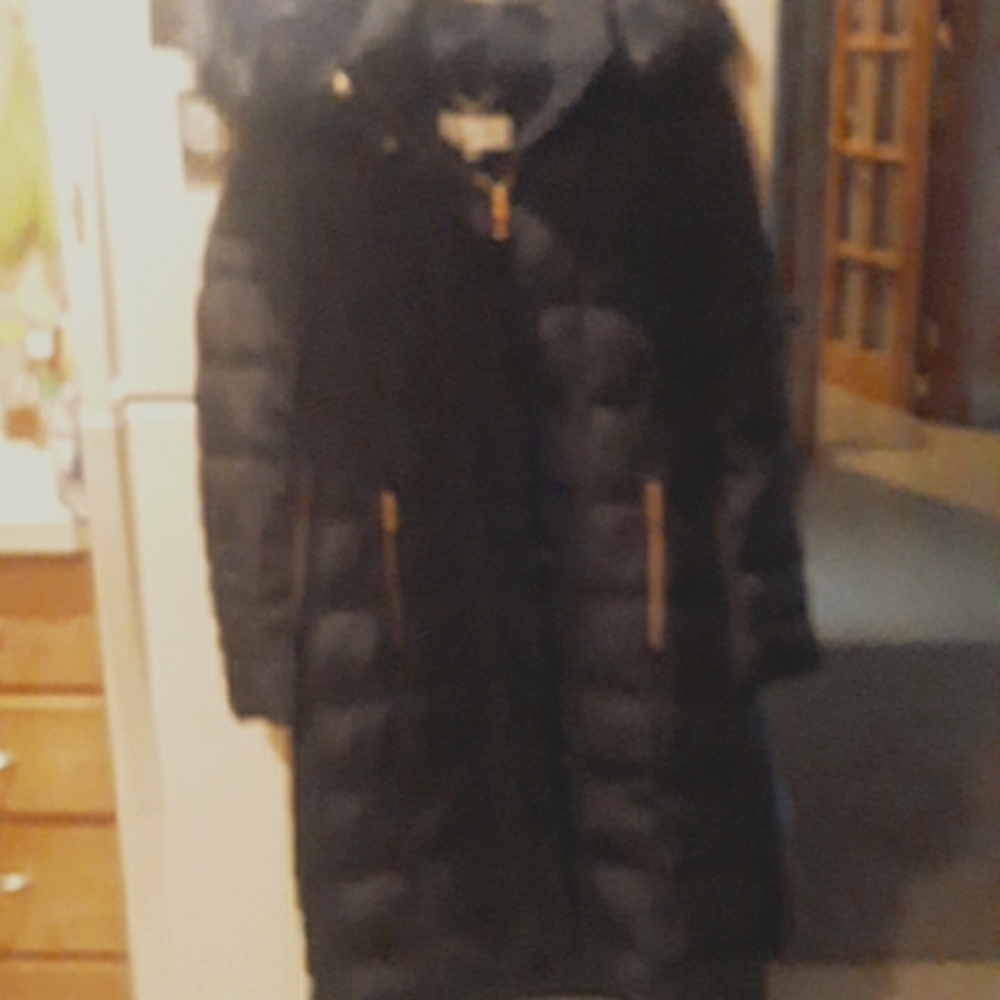 Womens Calvin Klein long black puffy jacket with gold zippers size S.